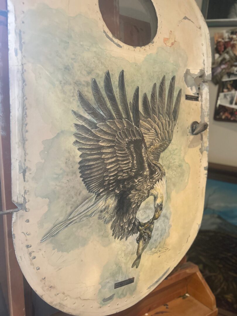 Vintage-style eagle illustration on a curved surface.